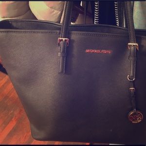 Beautiful Michael Kors jet, set, travel purse